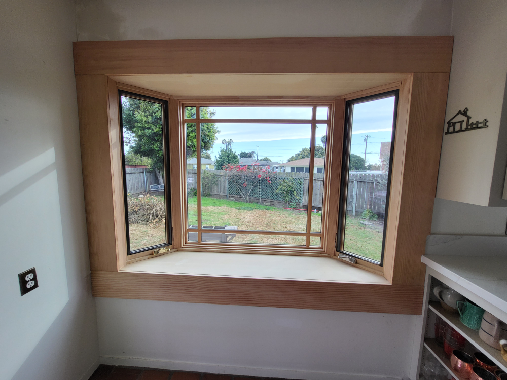 Windsor pinnacle aluminum clad exterior wood interior bay window.